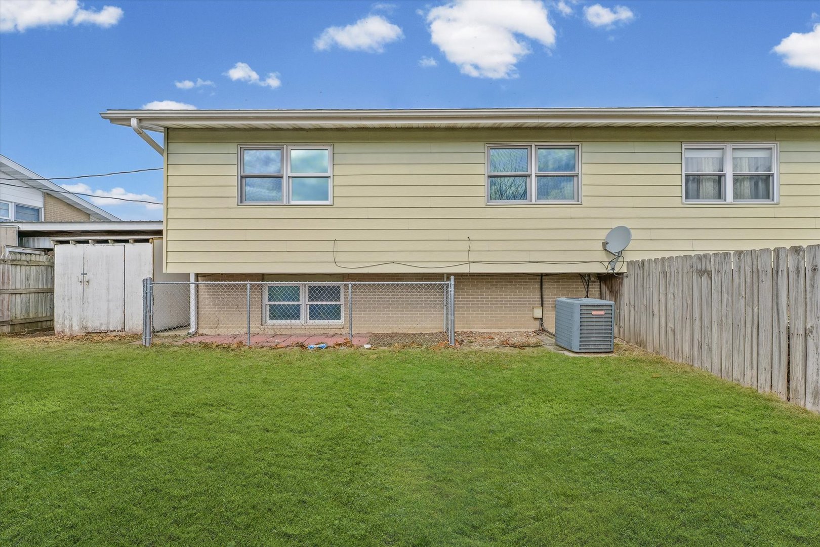 1612 Golfview Road Rantoul, IL 61866 - Photo 25 of 28 a front view of a house with a yard
