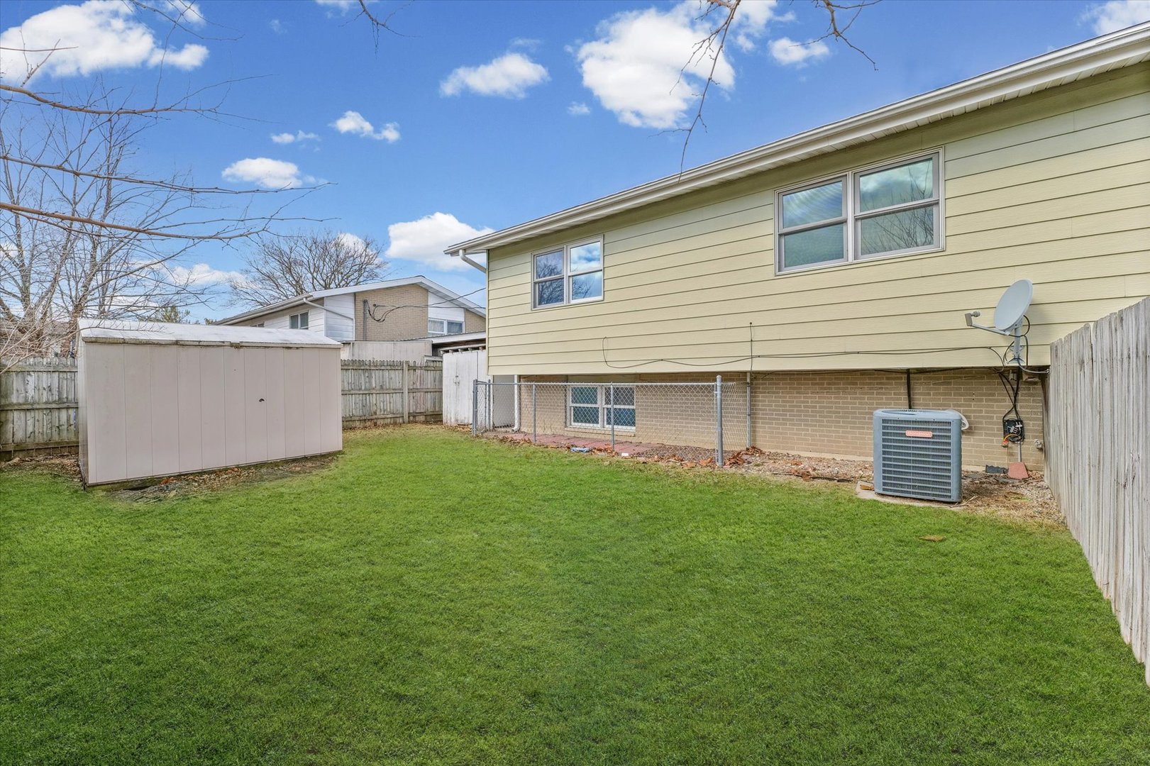 1612 Golfview Road Rantoul, IL 61866 - Photo 26 of 28 a backyard of a house with table and chairs