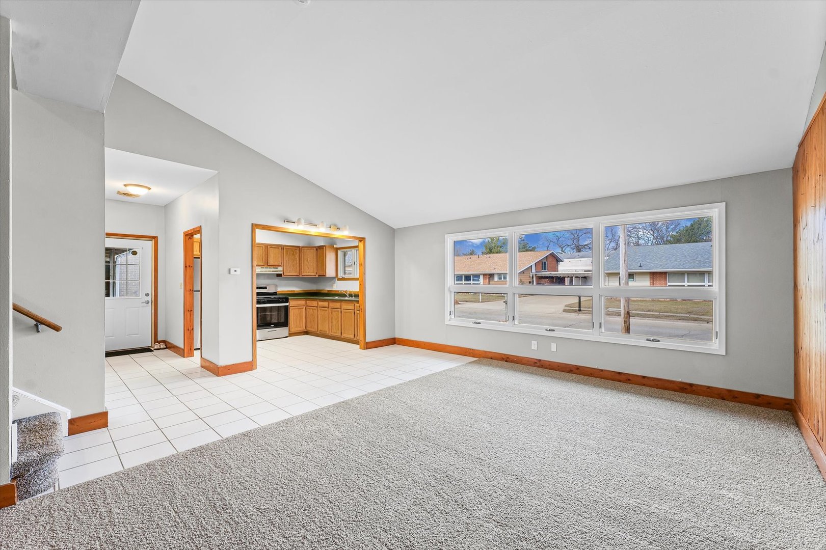 1612 Golfview Road Rantoul, IL 61866 - Photo 7 of 28 a very nice looking room with a large window and a rug