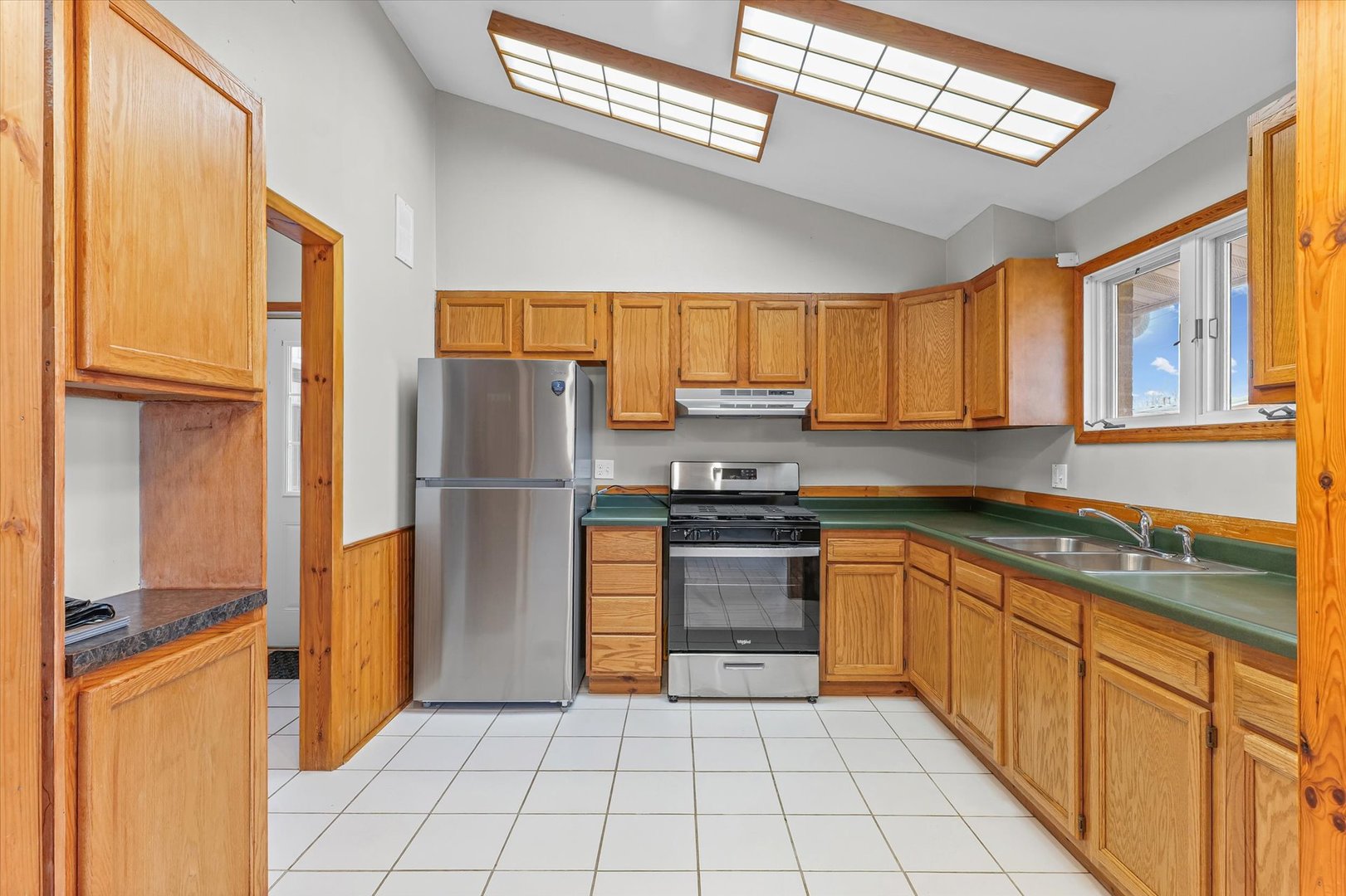 1612 Golfview Road Rantoul, IL 61866 - Photo 9 of 28 a kitchen with stainless steel appliances granite countertop a refrigerator oven a sink and dishwasher
