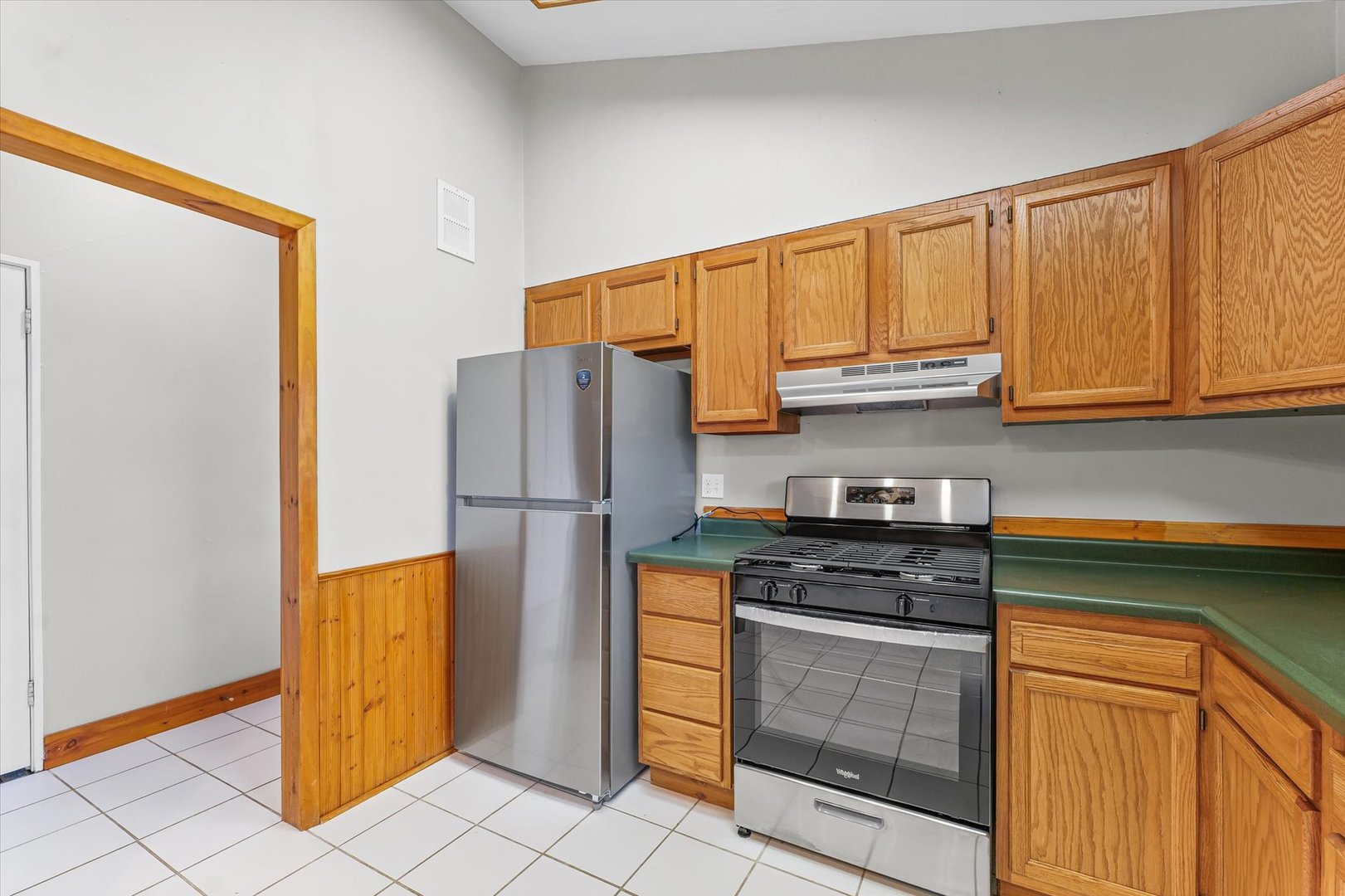 1612 Golfview Road Rantoul, IL 61866 - Photo 10 of 28 a kitchen with stainless steel appliances granite countertop a refrigerator sink and stove