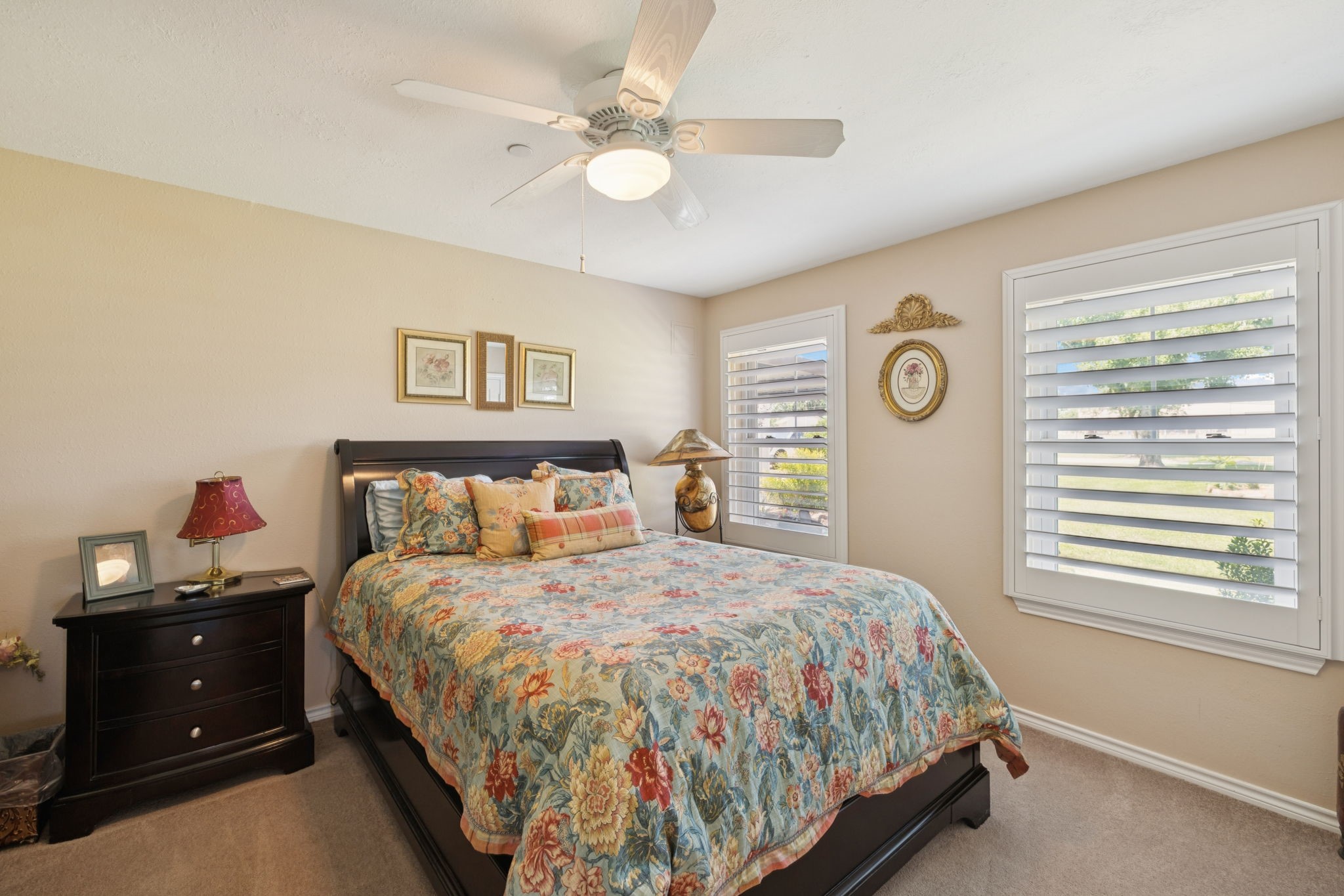 31229 Rochen Road Waller, TX 77484 - Photo 28 of 50 a bedroom with a bed and a chandelier