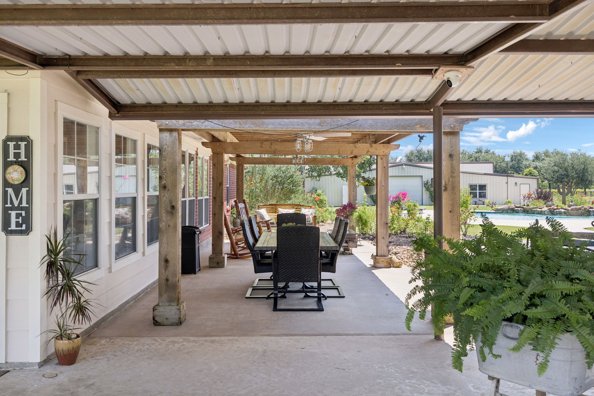 31229 Rochen Road Waller, TX 77484 - Photo 32 of 50 a view of a patio with table and chairs and potted plants