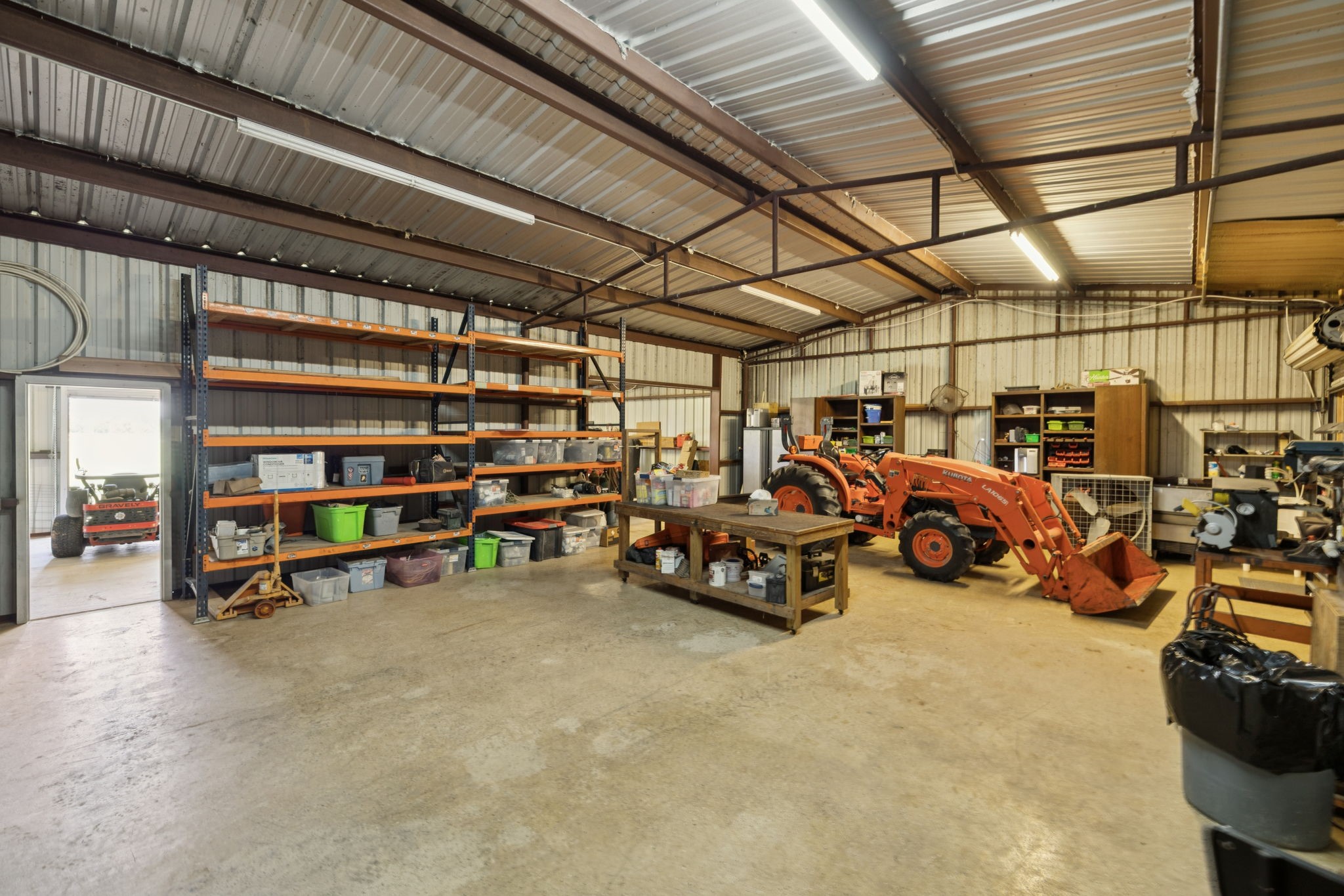31229 Rochen Road Waller, TX 77484 - Photo 38 of 50 a view of a garage with parked cars