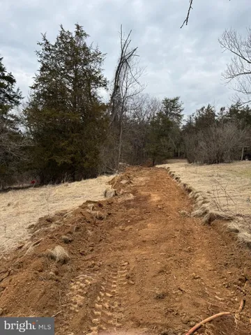 a view of snow on the side of a road
