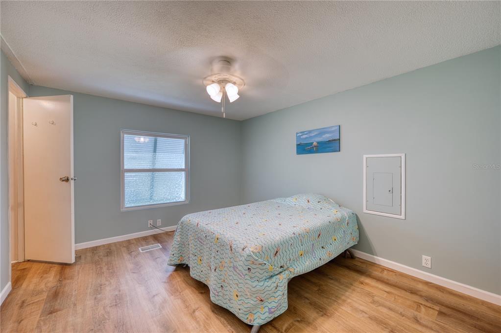 6269 Parakeet Road Englewood, FL 34224 - Photo 13 of 28 a bedroom with a bed and a window