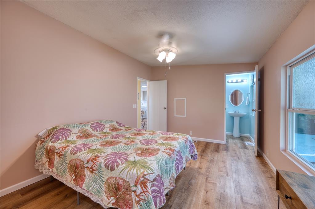 6269 Parakeet Road Englewood, FL 34224 - Photo 16 of 28 a bedroom with a bed and a window