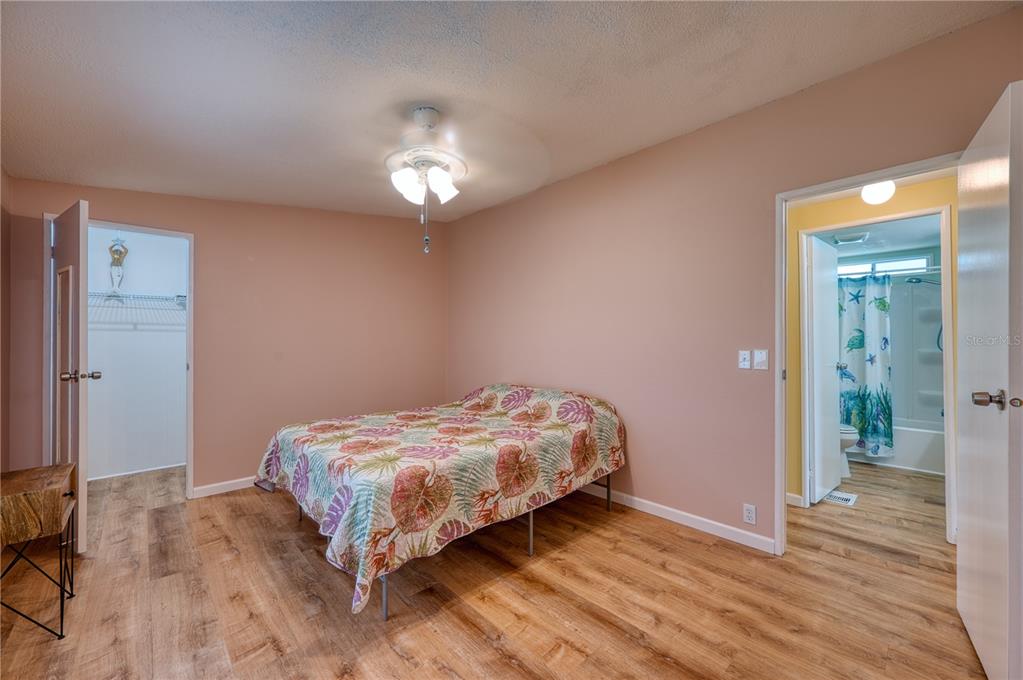 6269 Parakeet Road Englewood, FL 34224 - Photo 18 of 28 a bedroom with bed and window