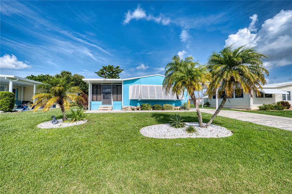 6269 Parakeet Road Englewood, FL 34224 - Photo 22 of 28 a view of a house with a swimming pool