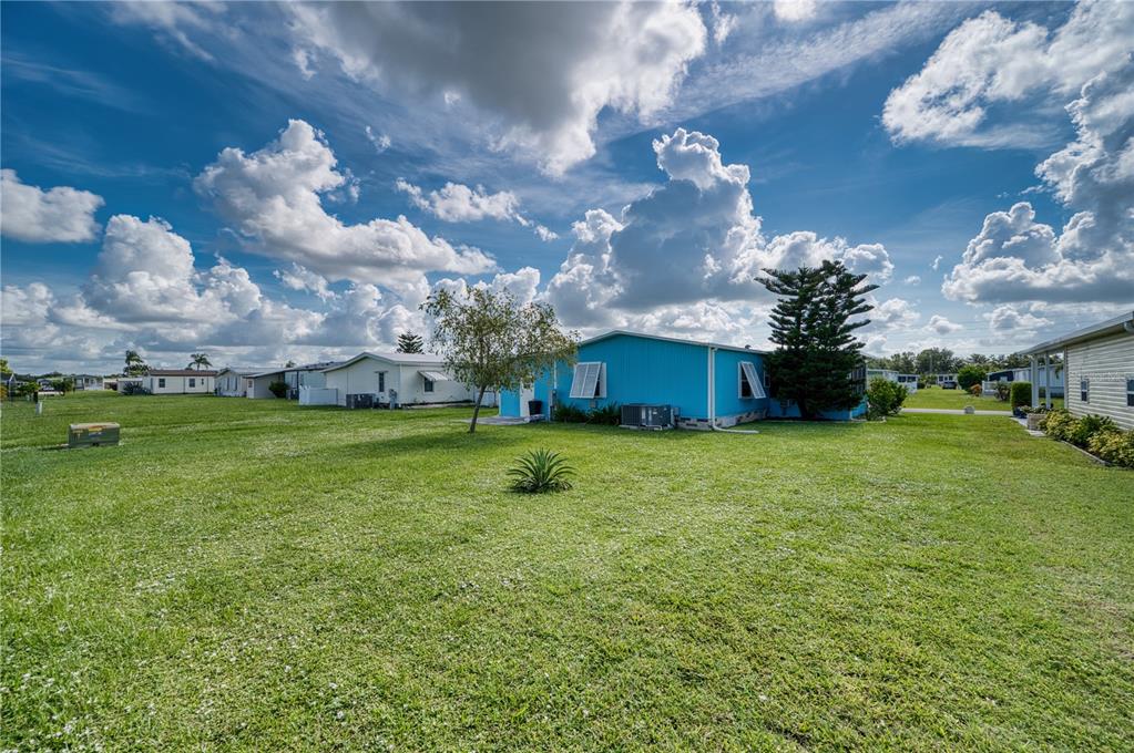 6269 Parakeet Road Englewood, FL 34224 - Photo 23 of 28 a view of a house with a big yard
