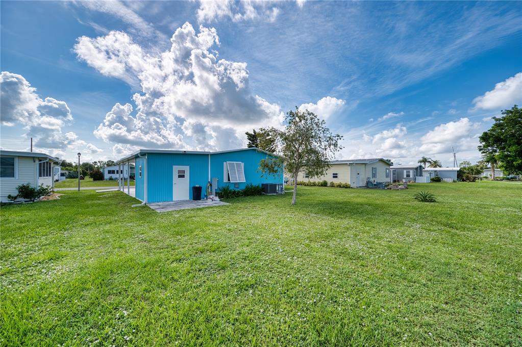 6269 Parakeet Road Englewood, FL 34224 - Photo 24 of 28 a view of a house with a back yard