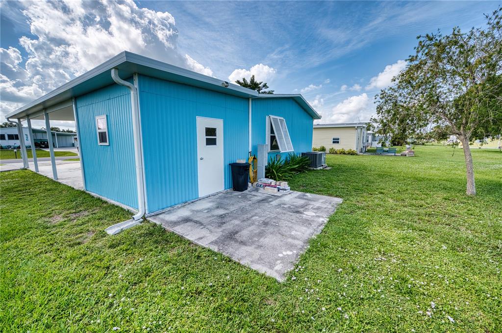 6269 Parakeet Road Englewood, FL 34224 - Photo 25 of 28 a front view of house with yard and trees