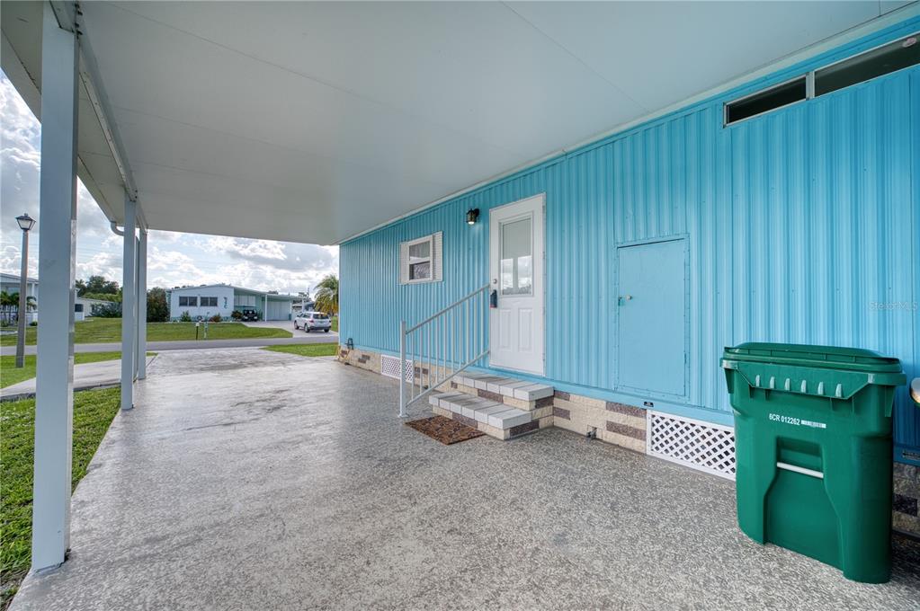 6269 Parakeet Road Englewood, FL 34224 - Photo 26 of 28 a view of a porch with hardwood floor and a window