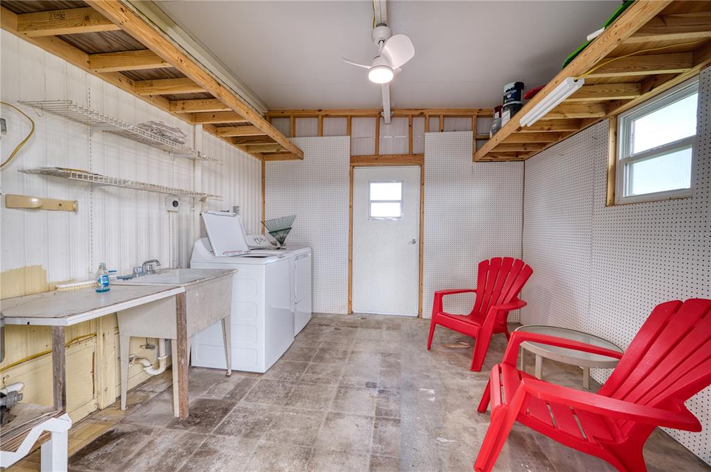 6269 Parakeet Road Englewood, FL 34224 - Photo 27 of 28 a utility room with sink dryer and washer