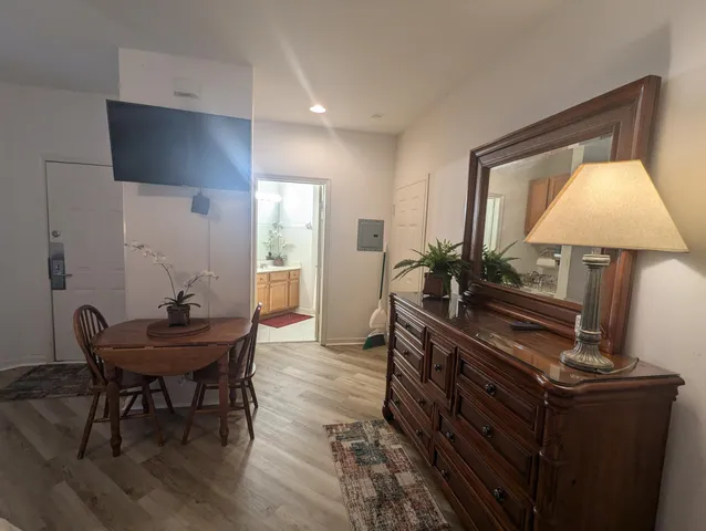 a living room with furniture and a lamp