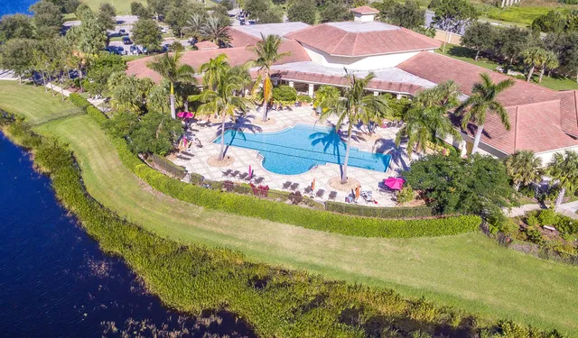 a view of a swimming pool with a yard