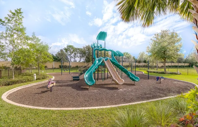 a view of outdoor space with swimming pool and slide
