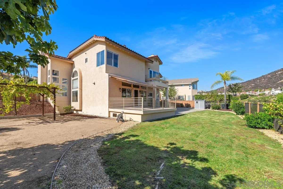 1819 Monarch Ridge Circle El Cajon, CA 92019 - Photo 25 of 60 a front view of a house with a yard