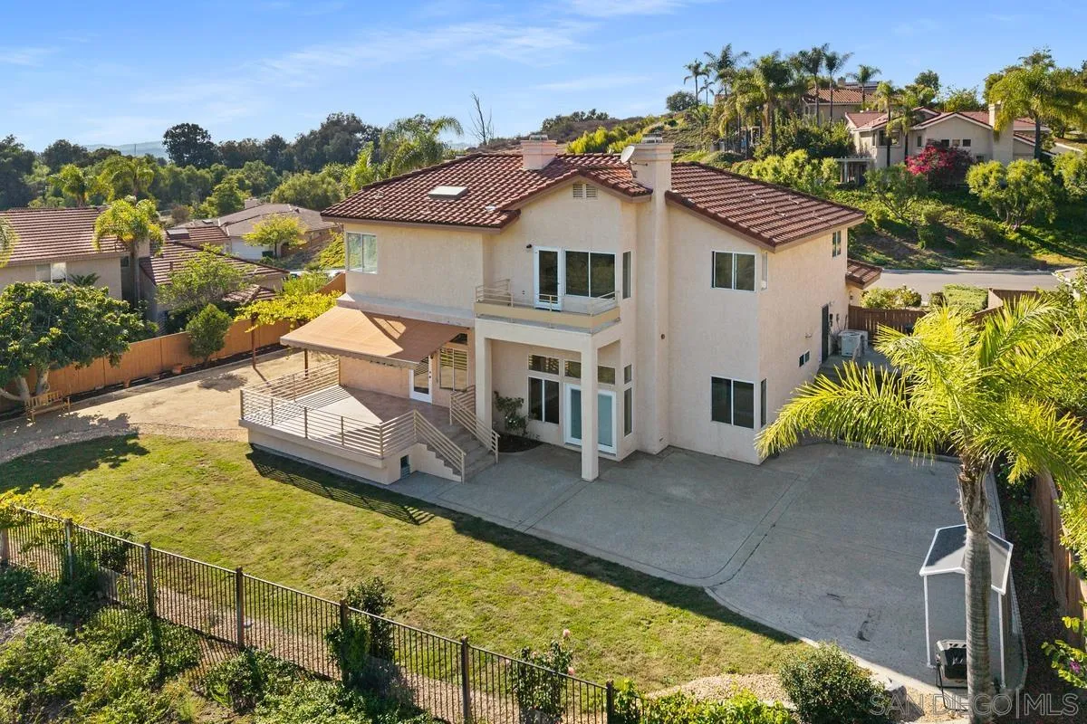 1819 Monarch Ridge Circle El Cajon, CA 92019 - Photo 31 of 60 an aerial view of a house with swimming pool lawn chairs and a yard