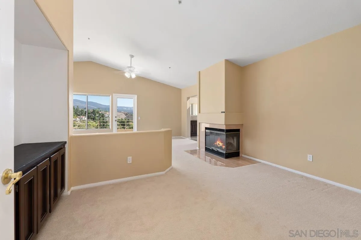 1819 Monarch Ridge Circle El Cajon, CA 92019 - Photo 32 of 60 a view of a livingroom with an empty space and a window