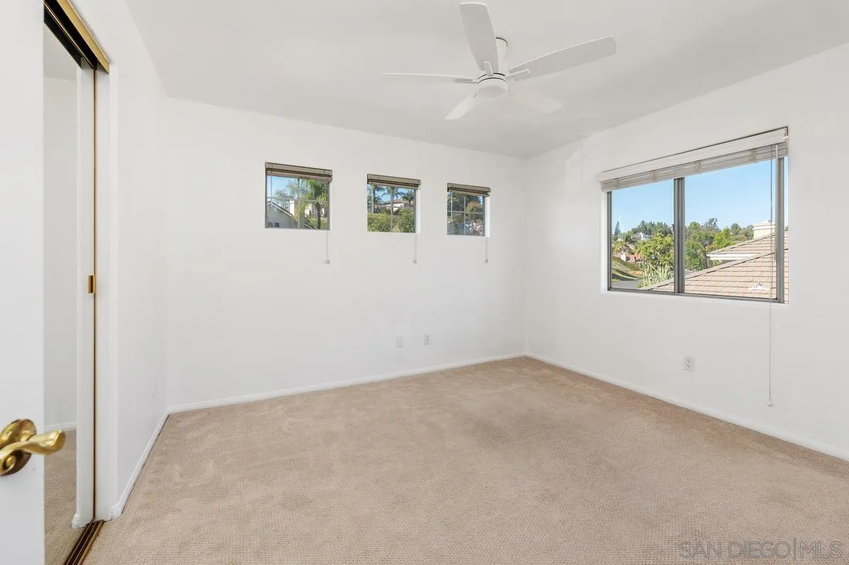 1819 Monarch Ridge Circle El Cajon, CA 92019 - Photo 44 of 60 an empty room with windows