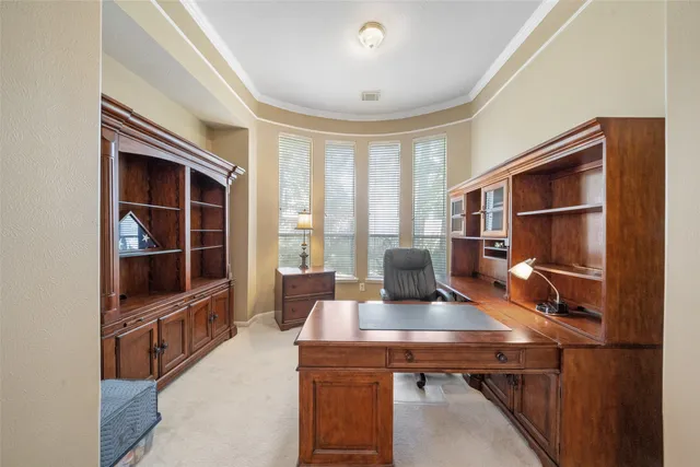 a view of a workspace with furniture