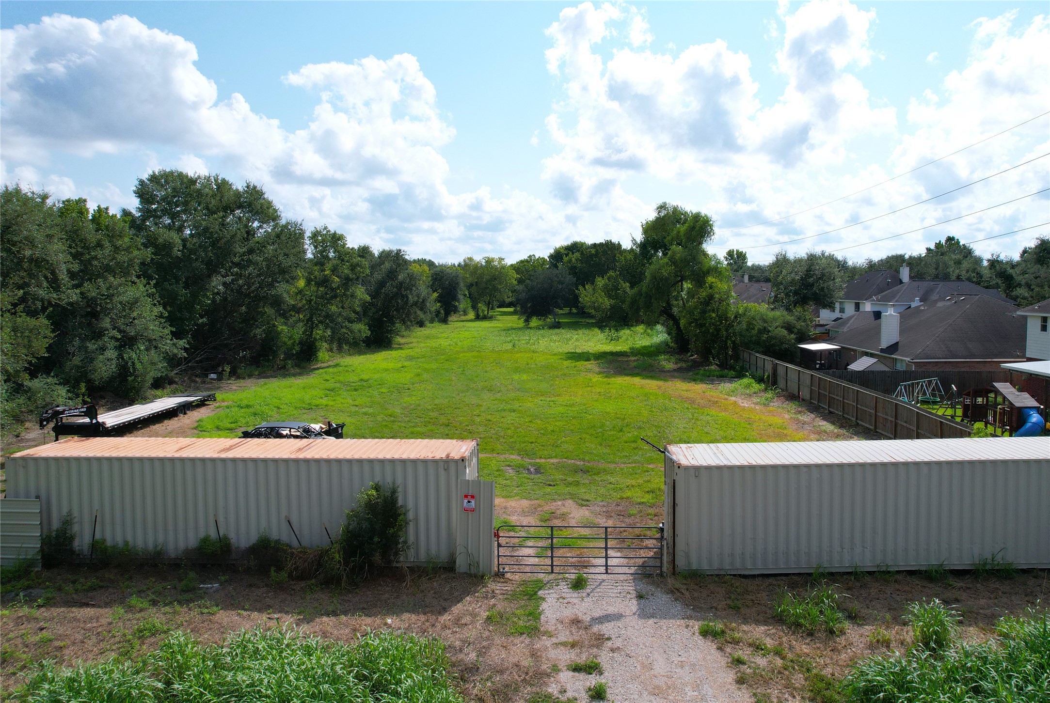 3733 Soho Drive Pearland, TX 77584 - Photo 4 of 8 a view of a swimming pool and deck in the backyard