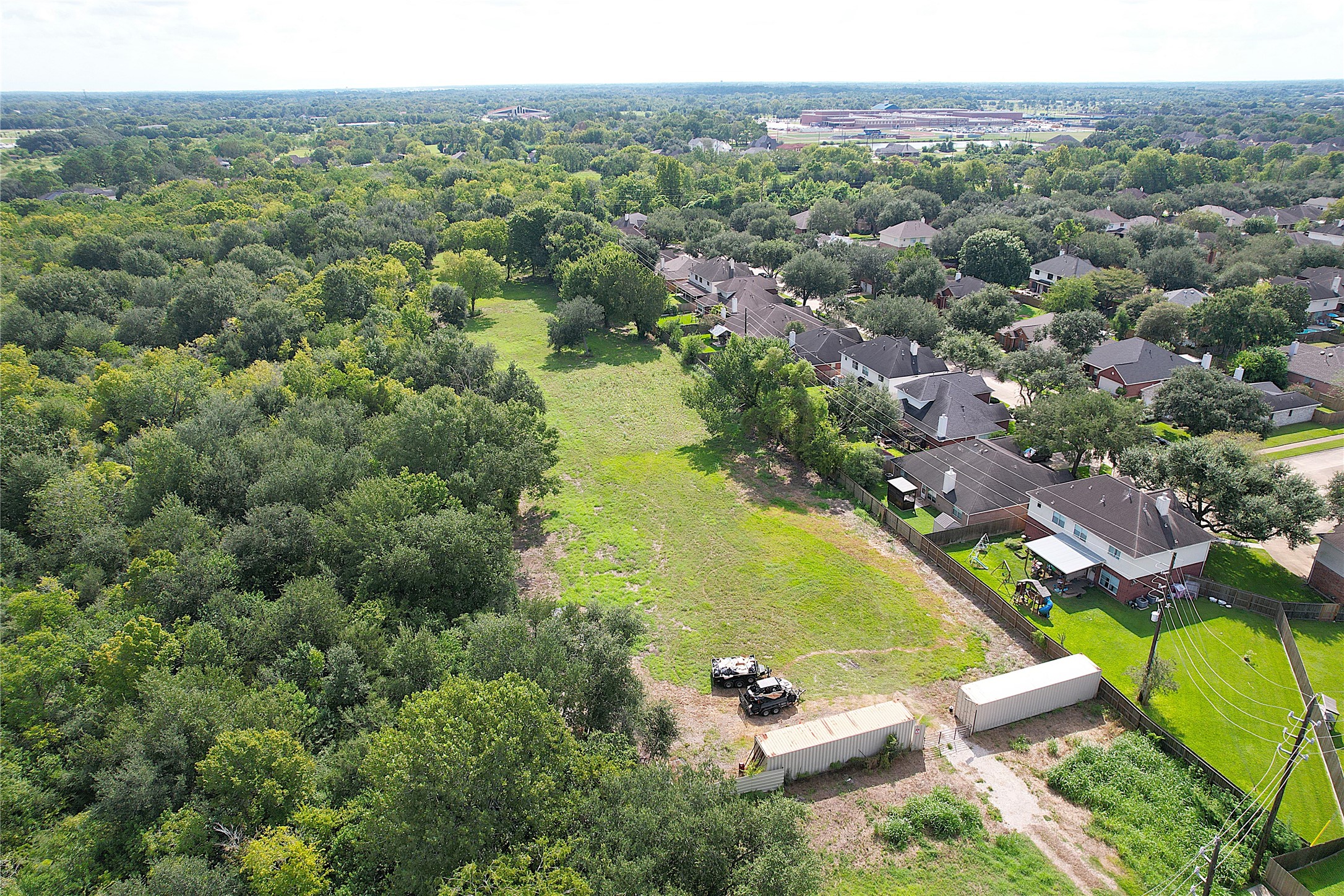3733 Soho Drive Pearland, TX 77584 - Photo 7 of 8 an aerial view of a swimming pool with a yard