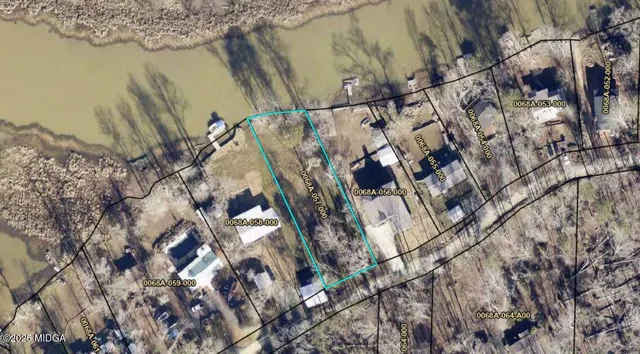 a view of a lake with a yard