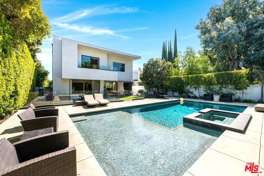 5101 Rubio Avenue Encino, CA 91436 - Photo 15 of 23 a view of a house with swimming pool and sitting area