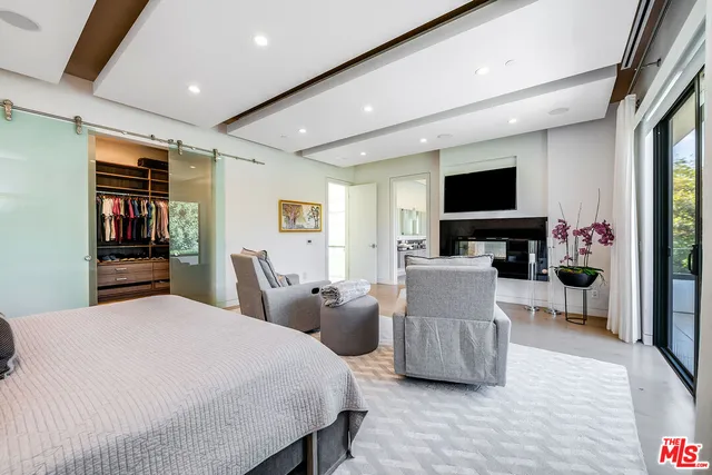 a white bath tub sitting in a bathroom next to a window
