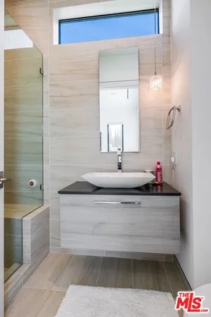 a bathroom with a bathtub and a sink