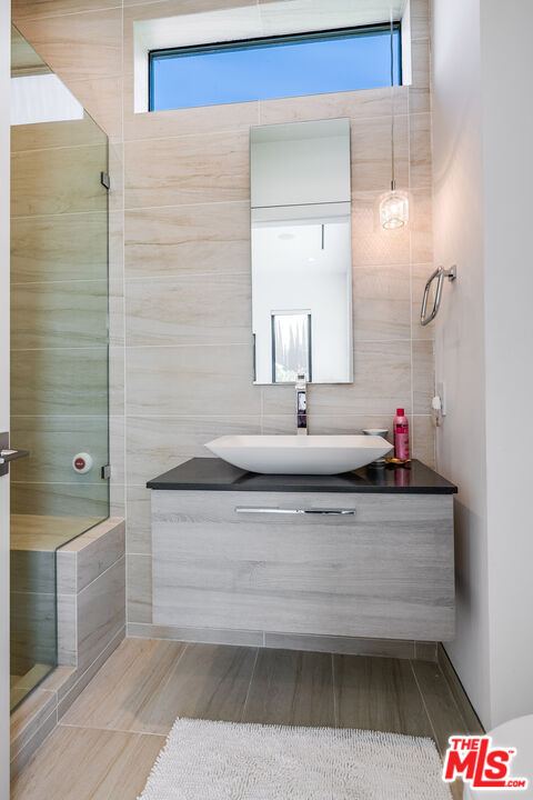 5101 Rubio Avenue Encino, CA 91436 - Photo 23 of 23 a bathroom with a bathtub and a sink