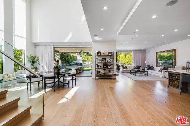 a large kitchen with a table and chairs