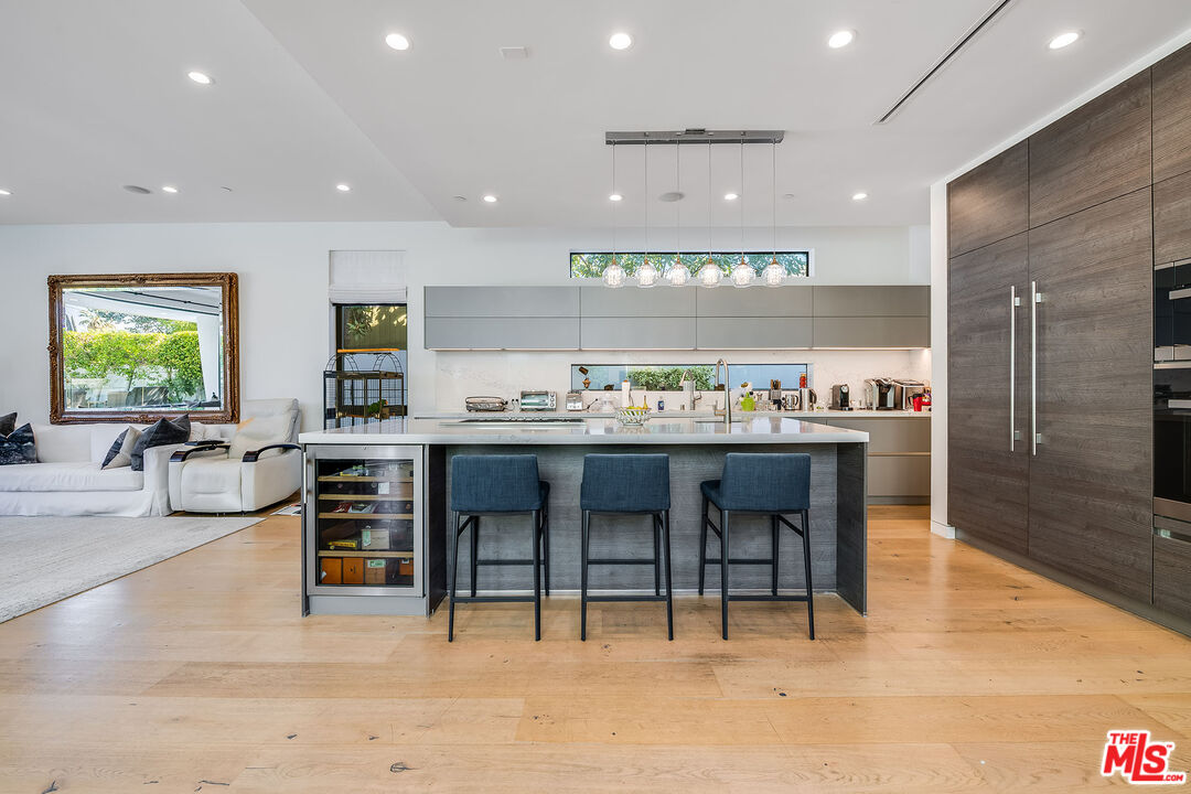 5101 Rubio Avenue Encino, CA 91436 - Photo 5 of 23 a large kitchen with a table and chairs
