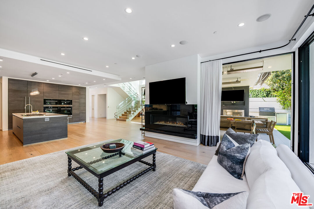 5101 Rubio Avenue Encino, CA 91436 - Photo 8 of 23 a living room with furniture and a flat screen tv