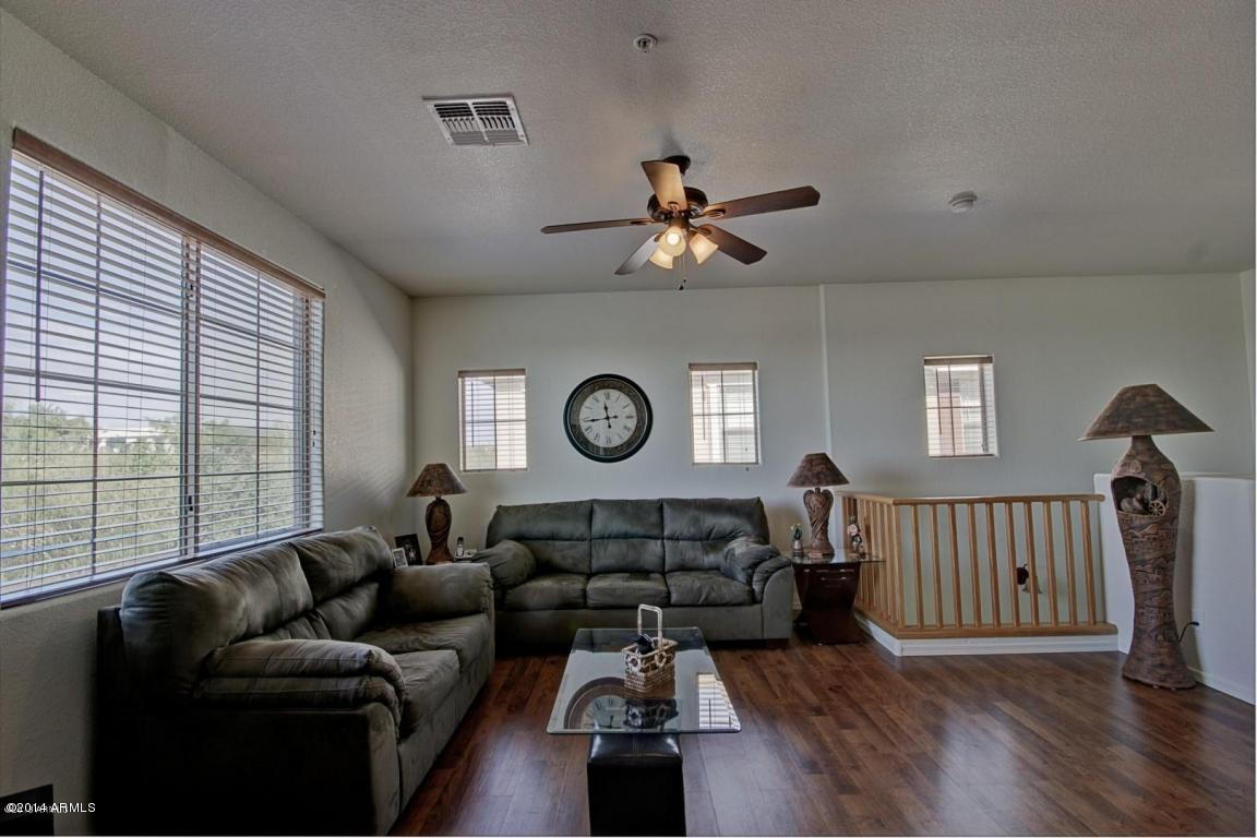 1250 South Rialto, Unit 62 Mesa, AZ 85209 - Photo 3 of 24 a living room with furniture wooden floor and a window