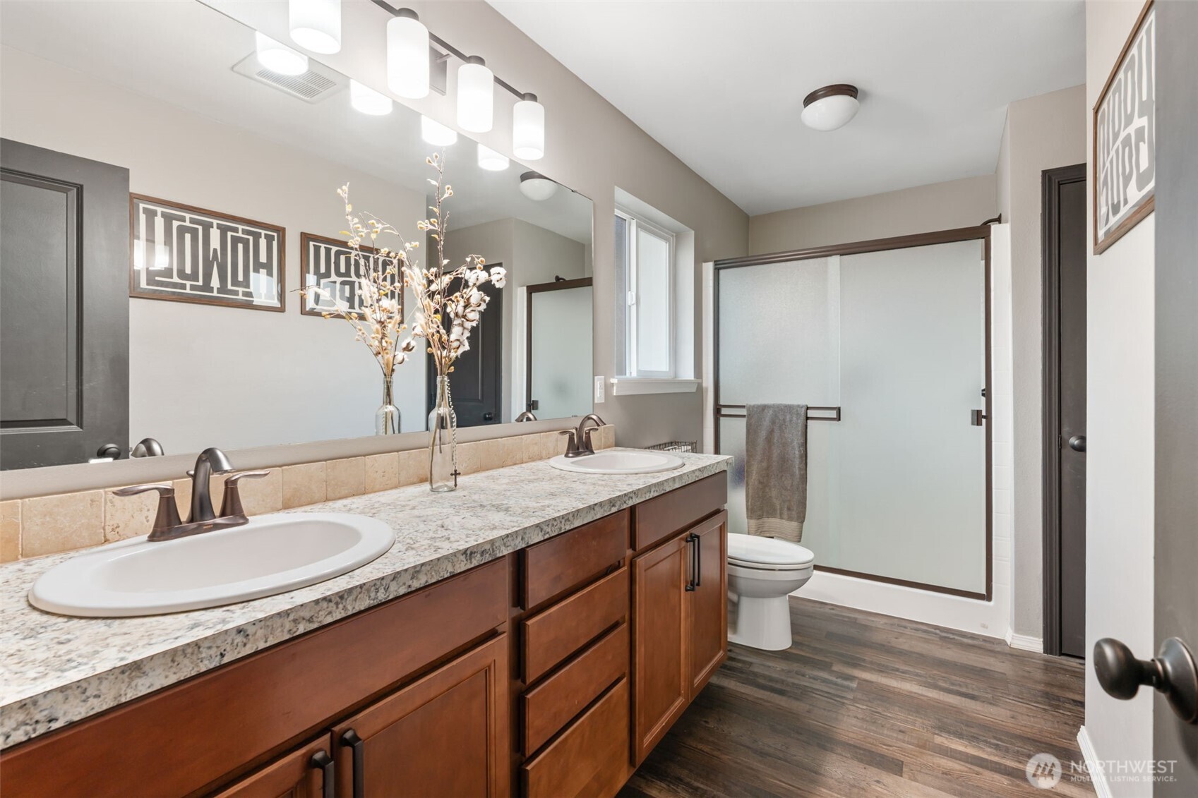 107 Haight Road Chehalis, WA 98532 - Photo 15 of 39 a bathroom with a granite countertop sink a toilet a mirror and vanity
