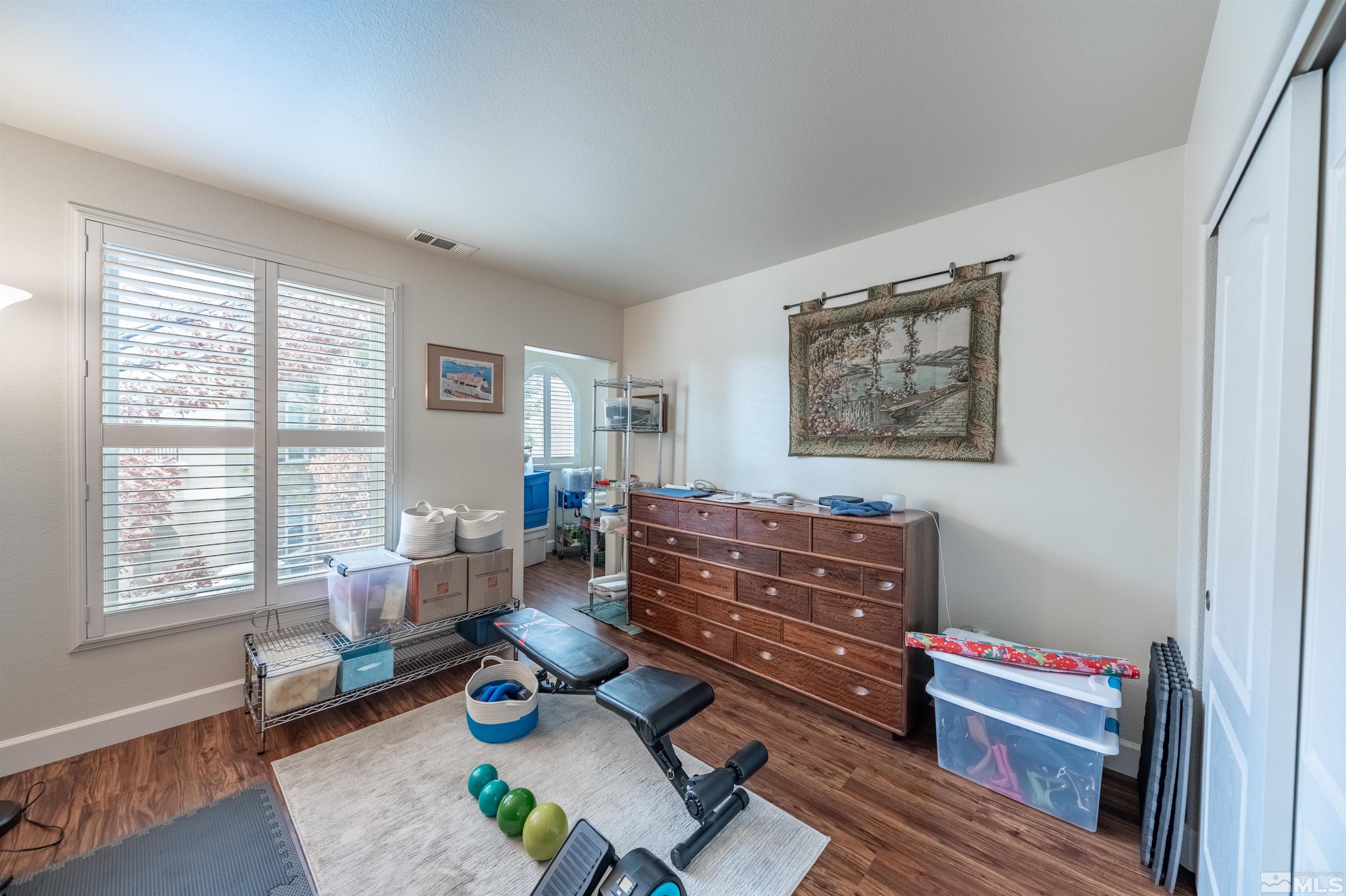 9050 Double R Boulevard, Unit 1925 Reno, NV 89521 - Photo 17 of 32 a living room with furniture and a window