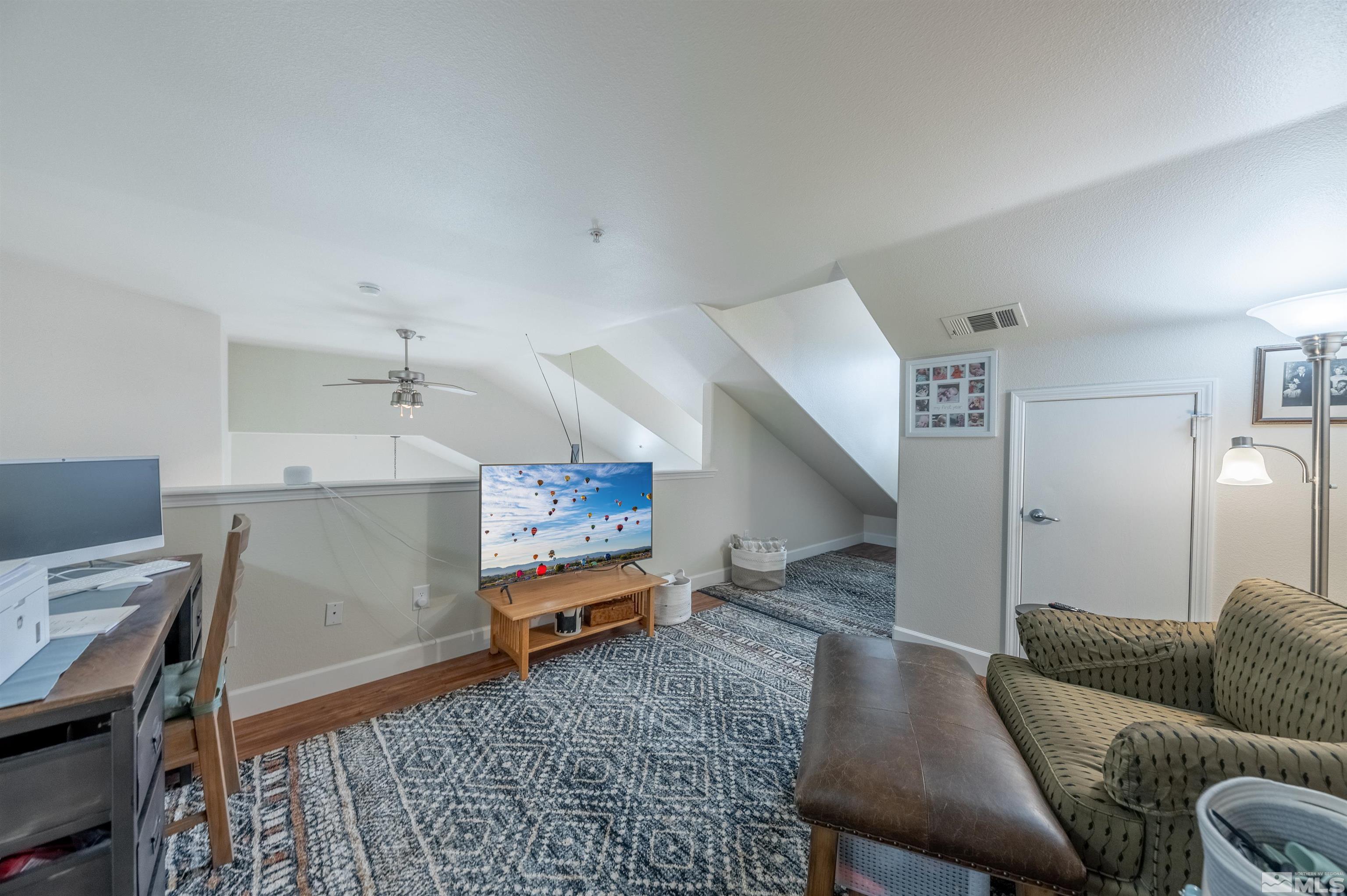 9050 Double R Boulevard, Unit 1925 Reno, NV 89521 - Photo 20 of 32 a living room with furniture and a rug