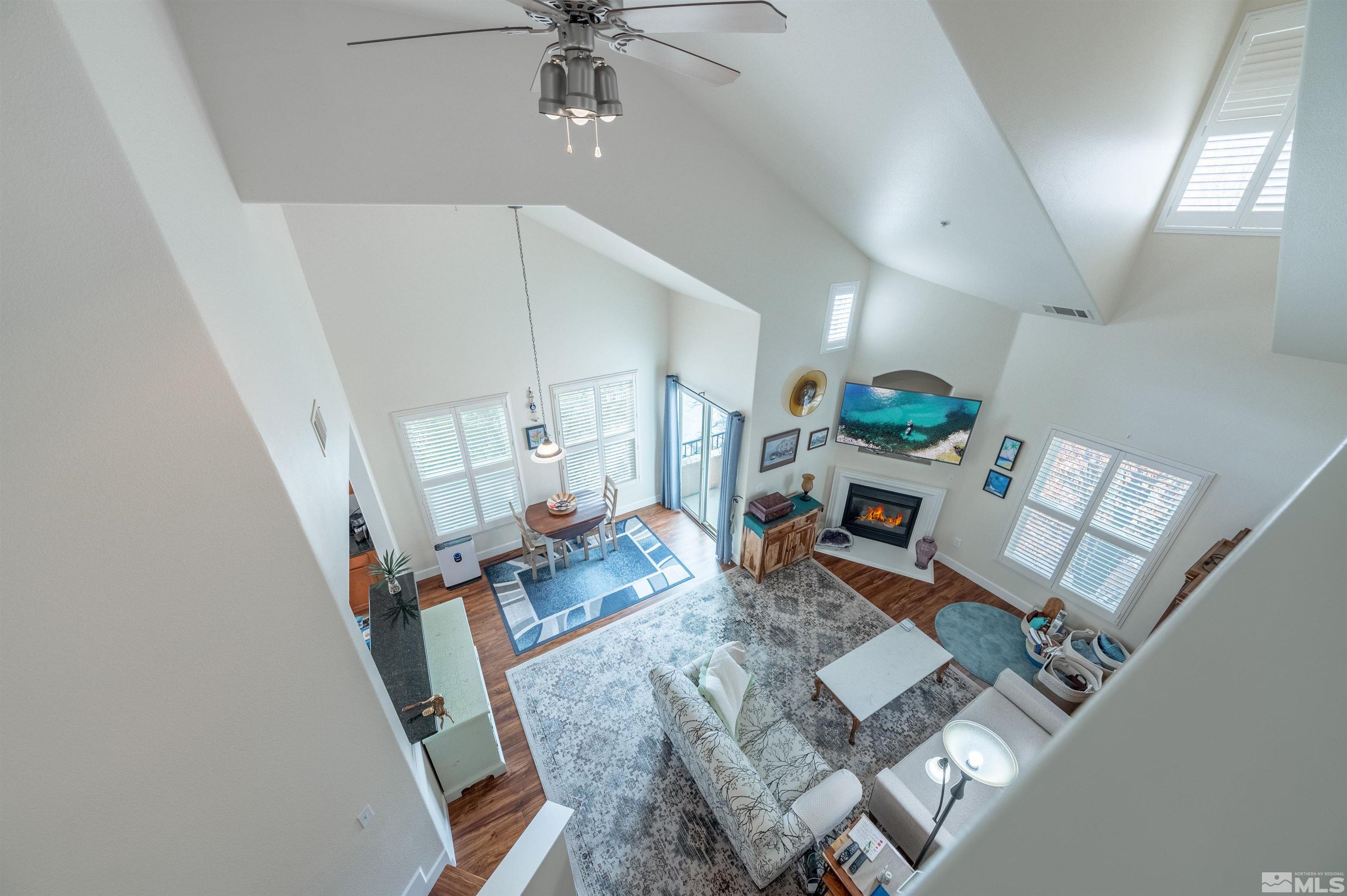 9050 Double R Boulevard, Unit 1925 Reno, NV 89521 - Photo 21 of 32 a living room with furniture and a wooden floor