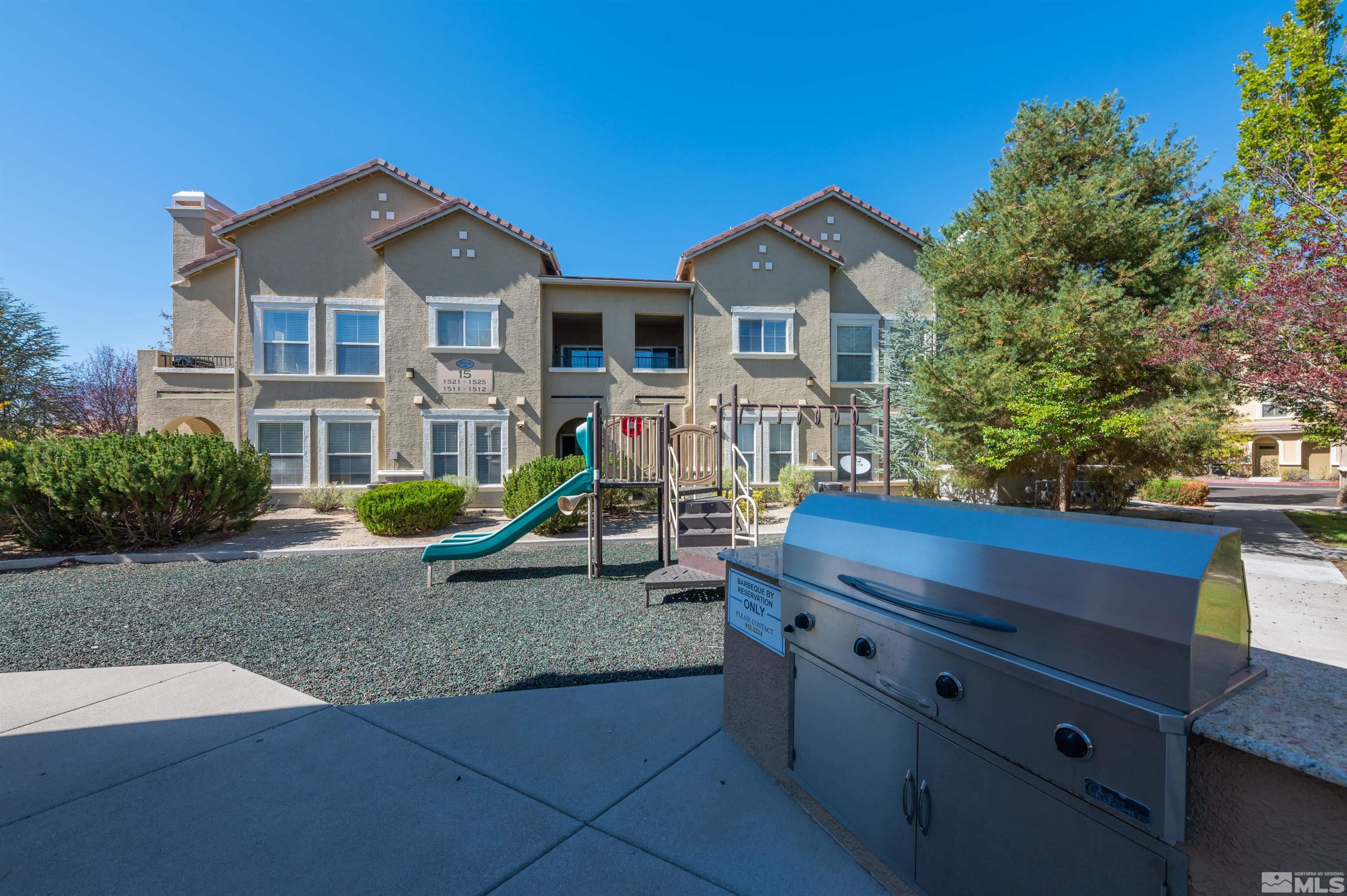 9050 Double R Boulevard, Unit 1925 Reno, NV 89521 - Photo 27 of 32 a view of a house with a yard