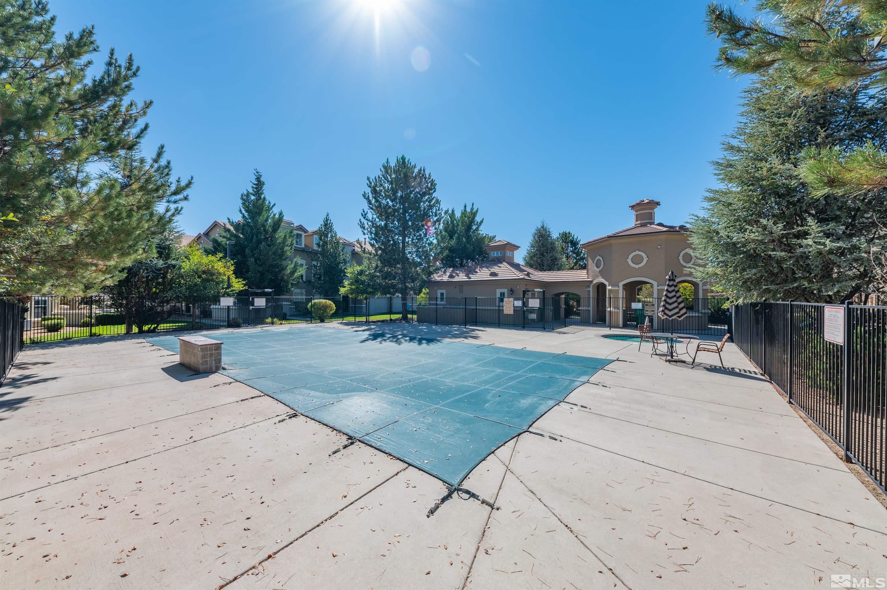 9050 Double R Boulevard, Unit 1925 Reno, NV 89521 - Photo 29 of 32 a view of a house with entertaining space and a street