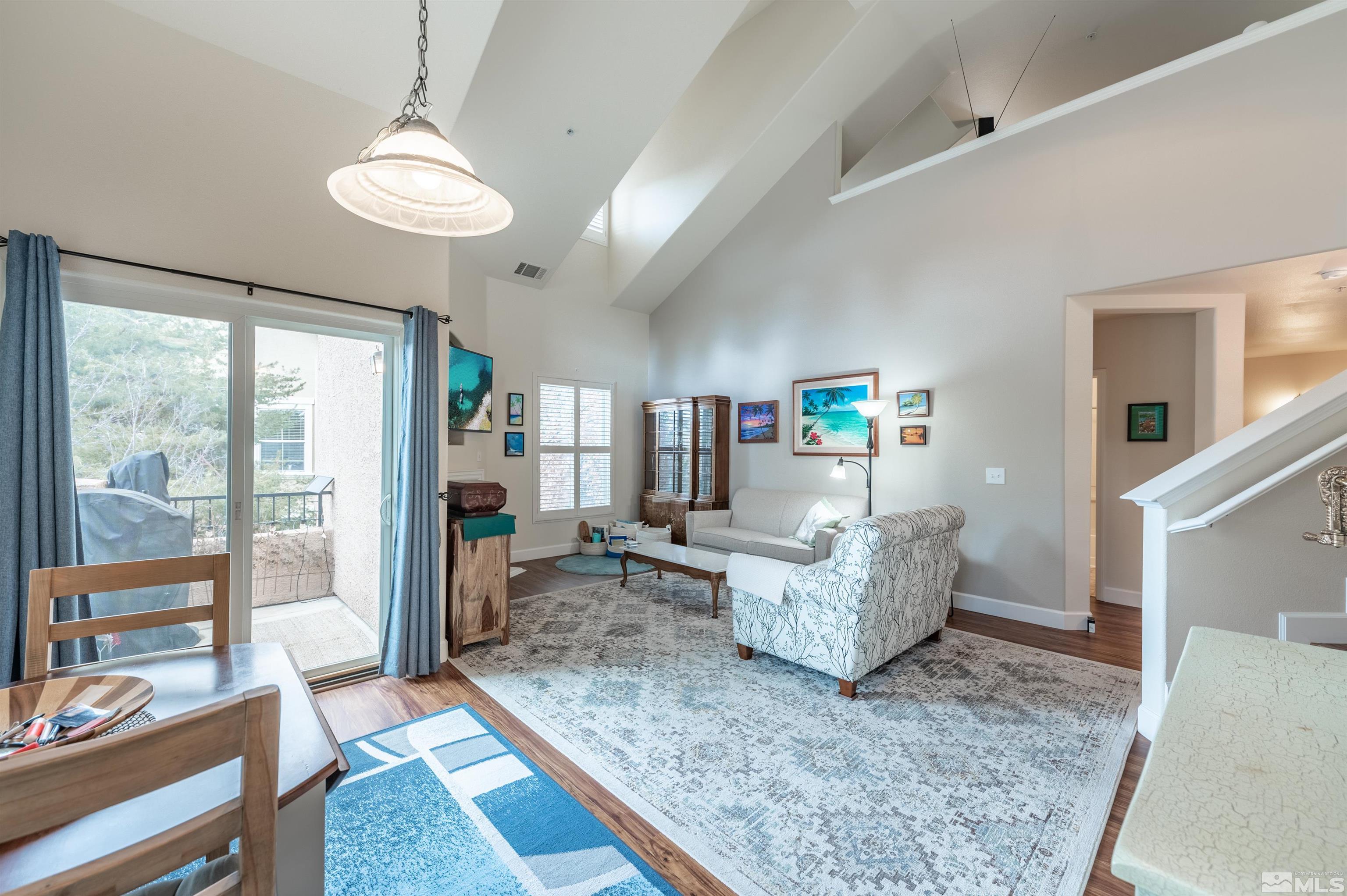 9050 Double R Boulevard, Unit 1925 Reno, NV 89521 - Photo 3 of 32 a living room with furniture and a large window