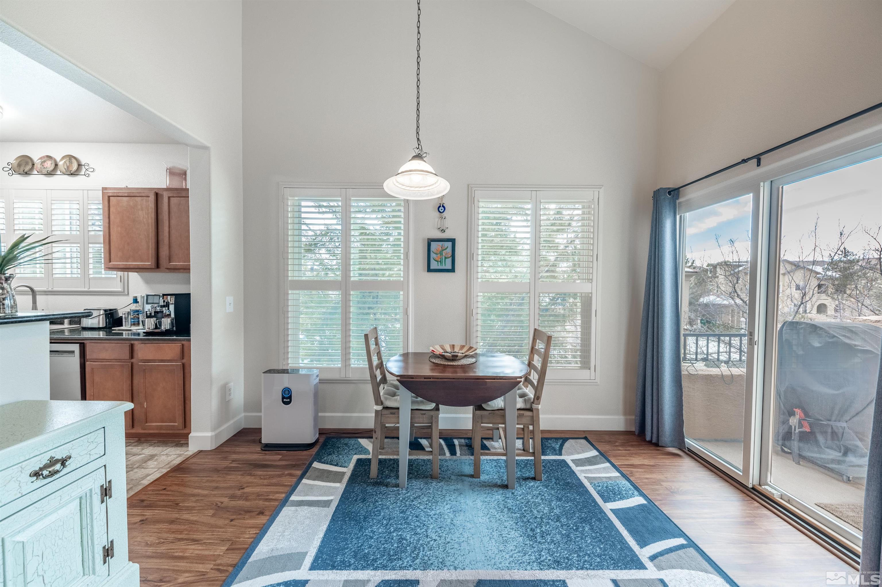 9050 Double R Boulevard, Unit 1925 Reno, NV 89521 - Photo 6 of 32 a dining room with furniture and window