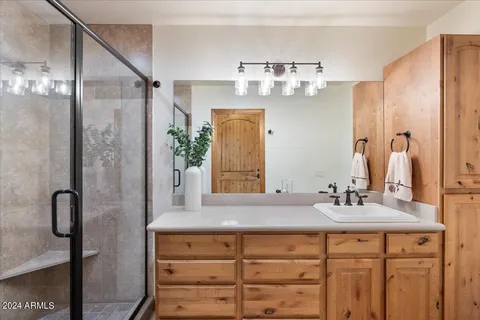 a bedroom with a bed and a dresser