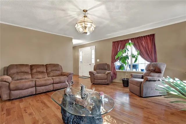 a kitchen with sink cabinets and wooden floor