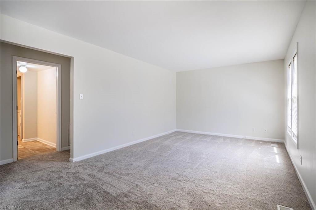 121 Westview Drive, Unit 43 Carrboro, NC 27510 - Photo 3 of 15 Bright Living room facing hall to bedrooms