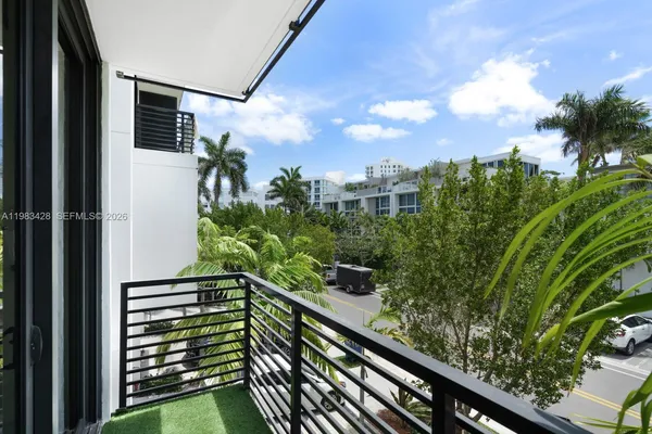 a view of a balcony with an outdoor space