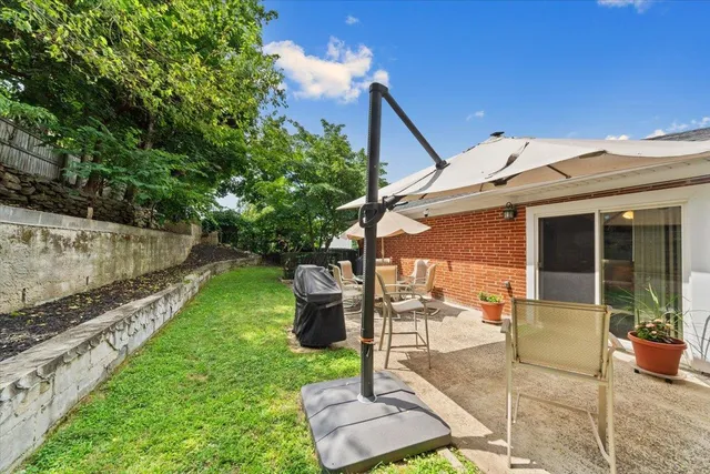 a backyard of a house with seating space